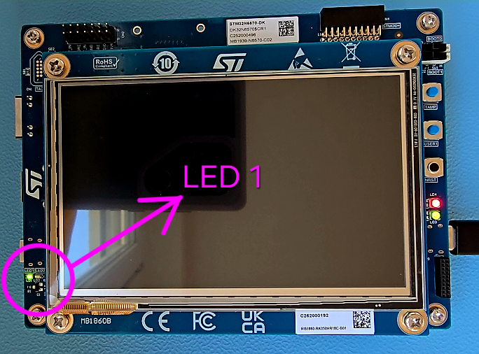The STM32N6570-DK with the LED 1 blinking.